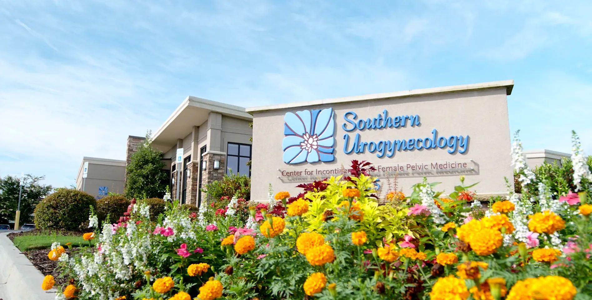 Southern Urogynecology building with flowers outside.