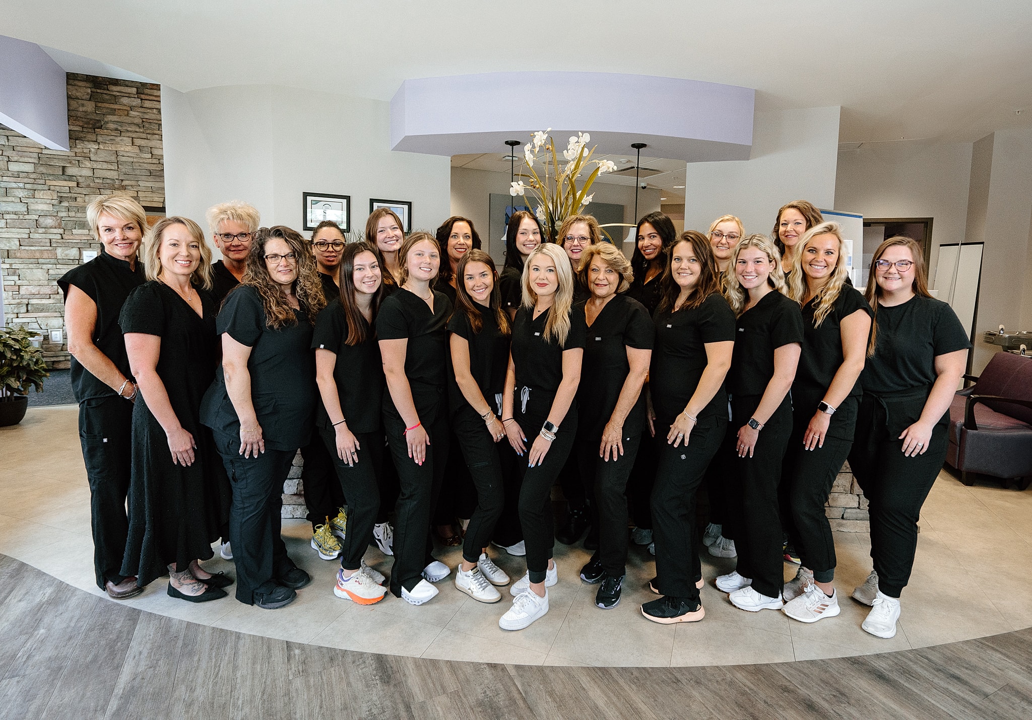 Group of healthcare professionals in black uniforms.